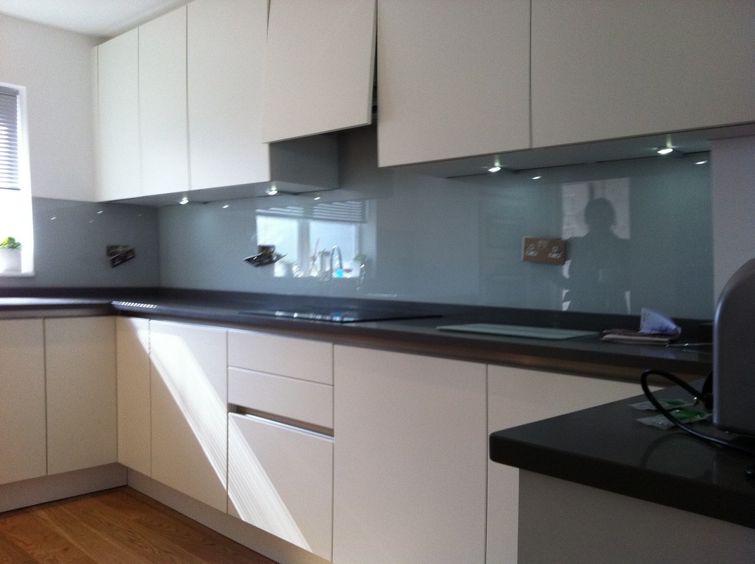 Grey glass kitchen splashback with LED lighting in Kingston upon Thames