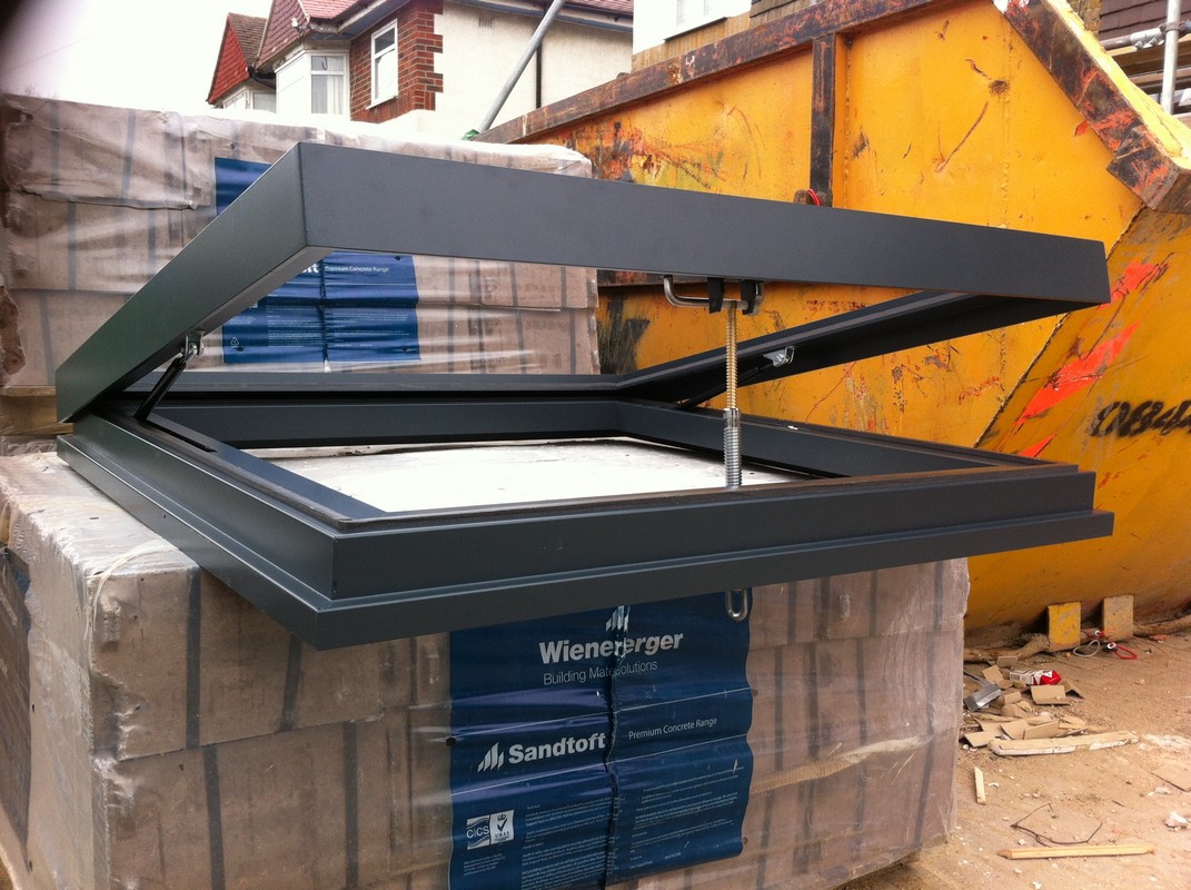 Opening flat roof skylight in anthracite grey installed in Kingston upon Thames